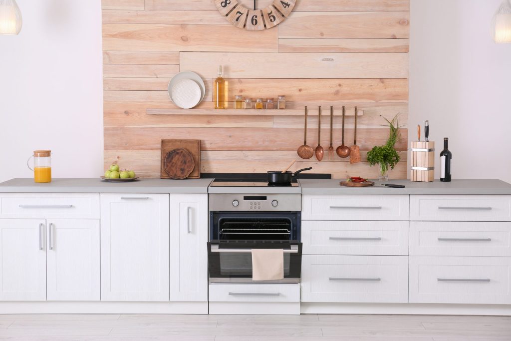 Bright kitchen with modern appliances and utensils.