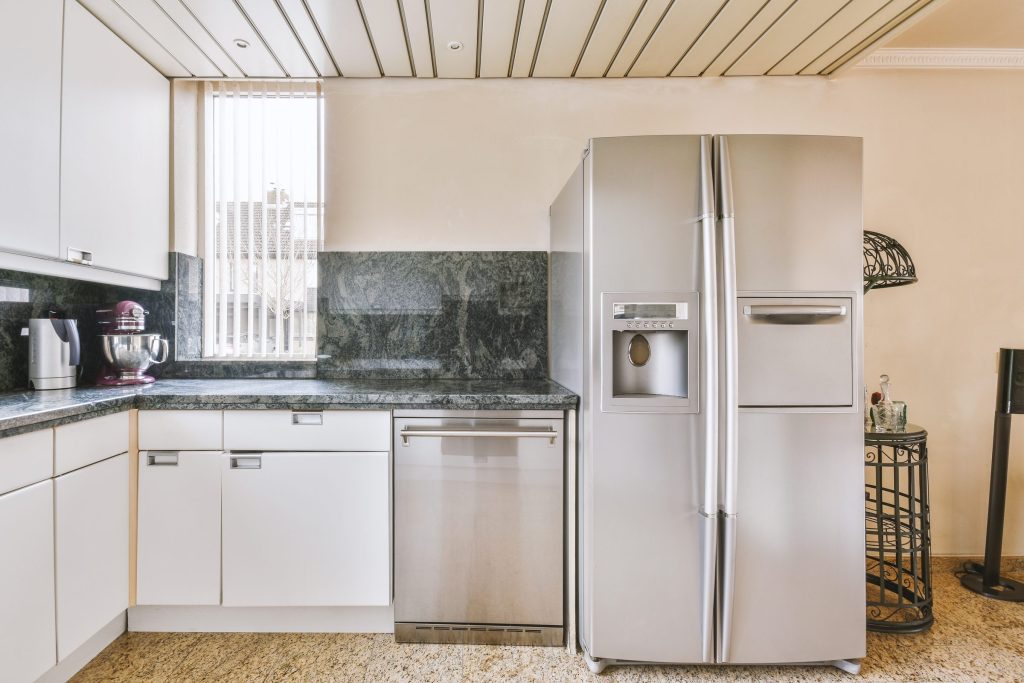 An oven in a bright modern kitchen interior.