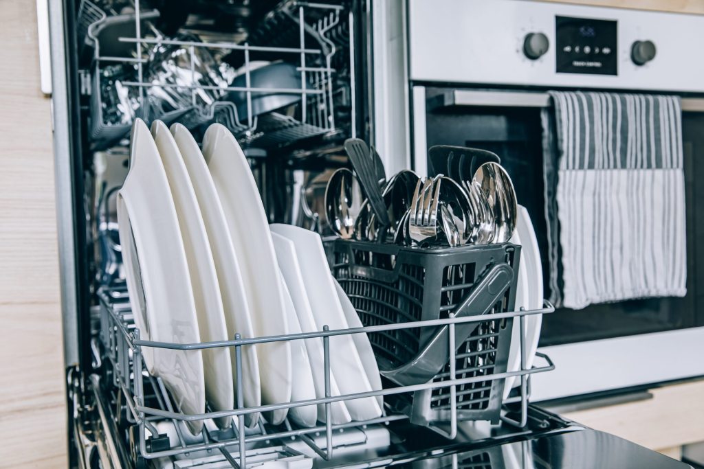 Clean dishes and silverware in dishwasher.