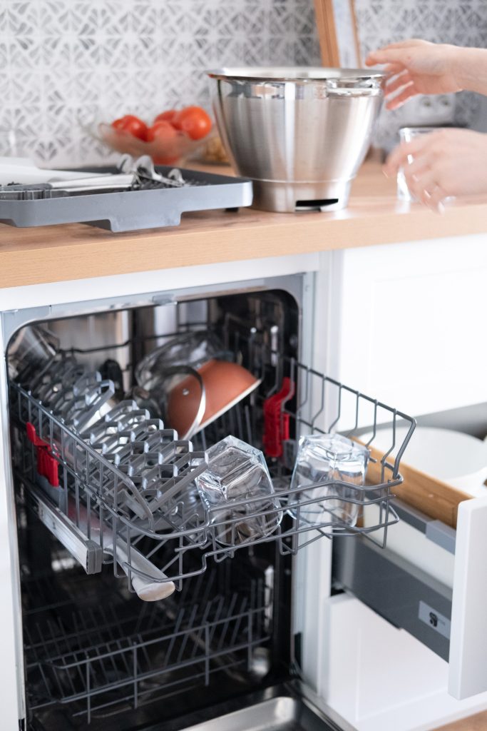 Clean glasses and dishes in the dishwasher.