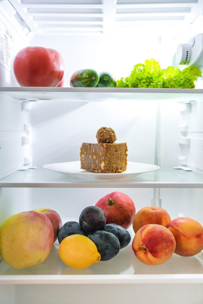 Fresh food and dessert in refrigerator.