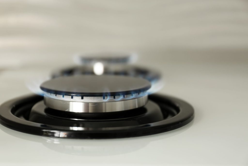 Gas burner on a stove top ignited.