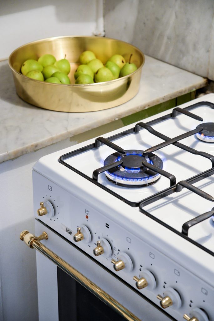 Green pears and gas stove.
