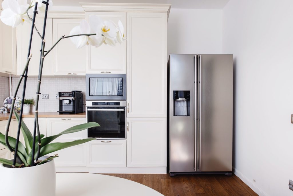Modern appliances and new design in kitchen loft.