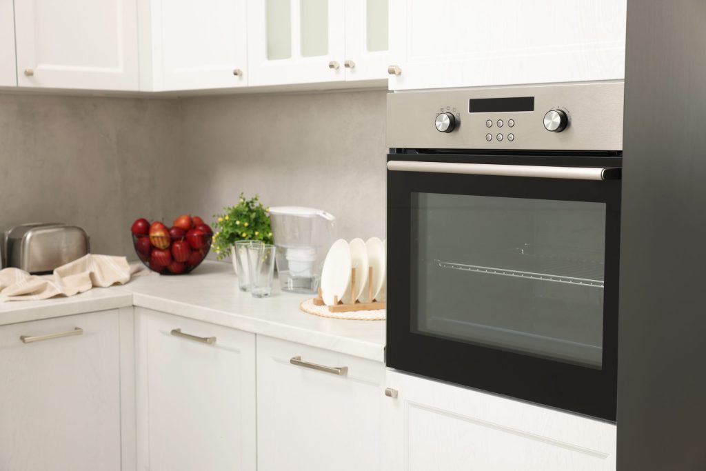 Modern kitchen interior with built in oven.