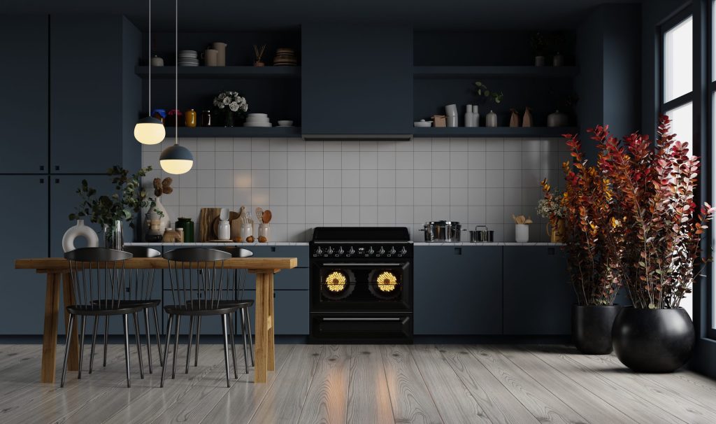 An oven in a modern kitchen interior with dark blue accents.