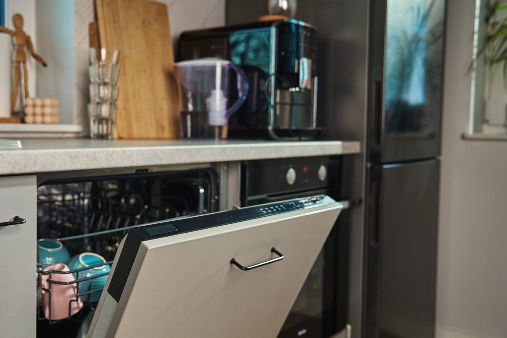 Modern kitchen interior with dishwasher.