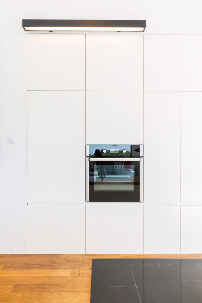 An oven in a modern kitchen interior featuring.