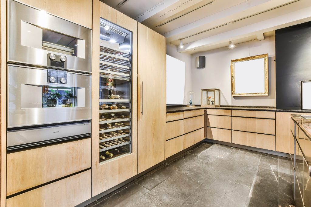 Modern kitchen with stainless steel appliances.