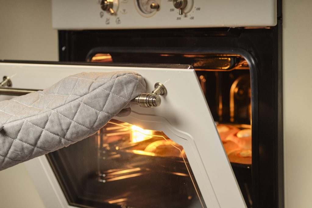 Oven door open with baking inside.