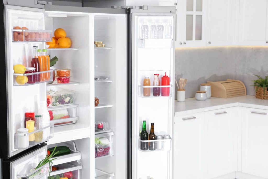 Refrigerator stocked with drinks and food.
