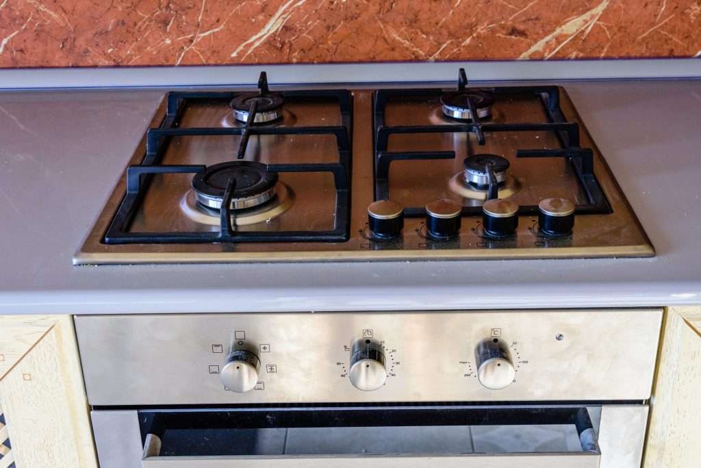 Stainless steel stove top and oven.