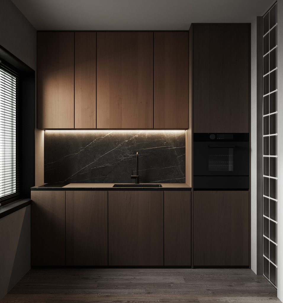 A walnut kitchen with a dark stone splashback and a built-in oven.