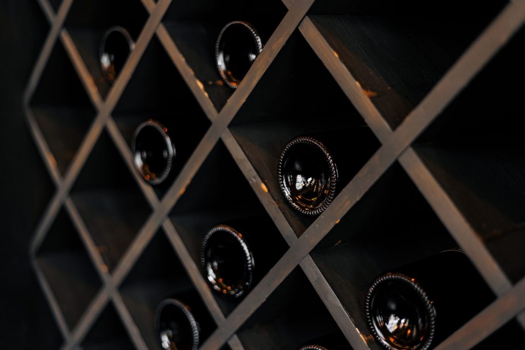 Bottle ends in a diamond wooden rack.